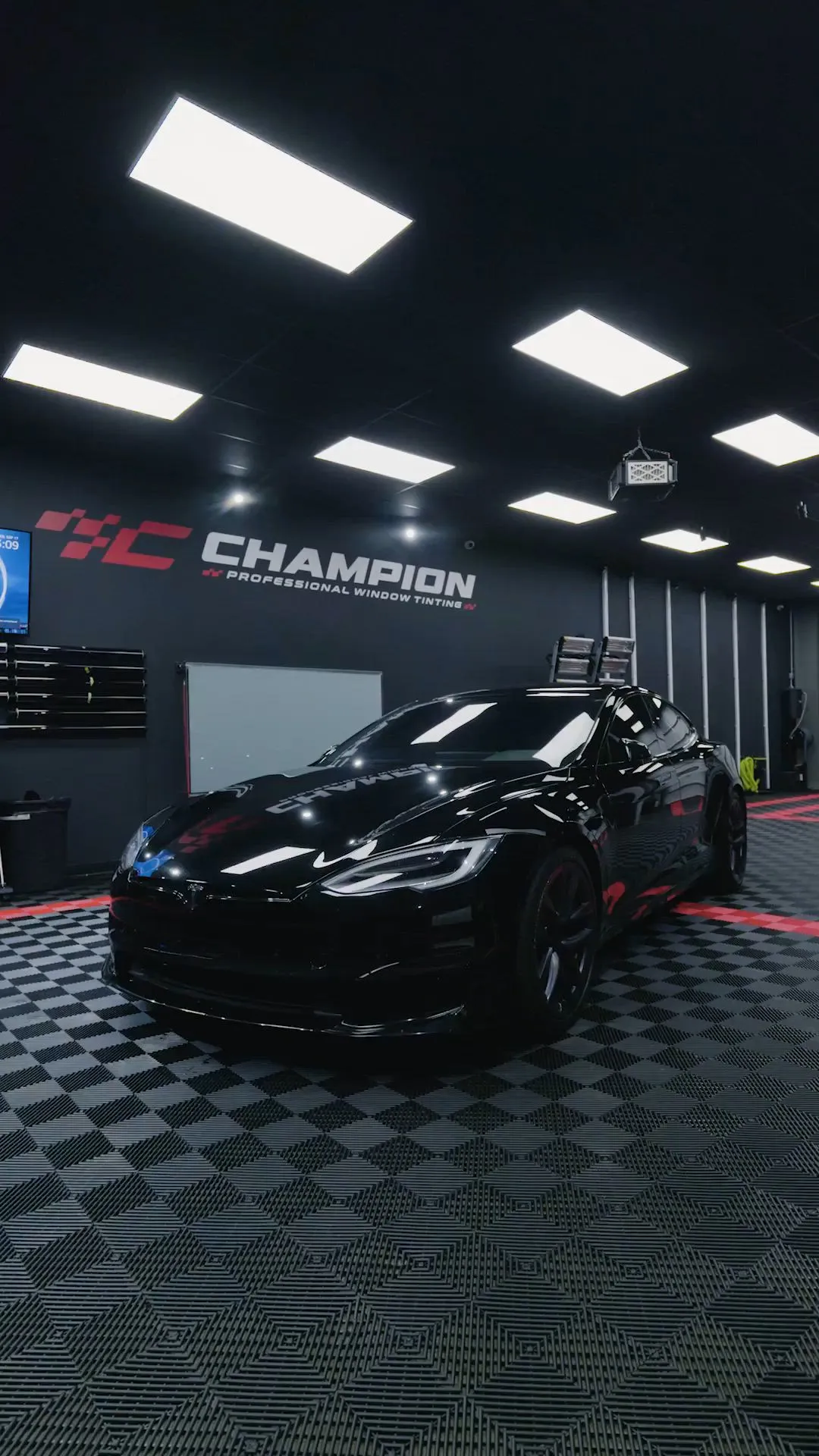 Original Champion black Tesla showroom video poster